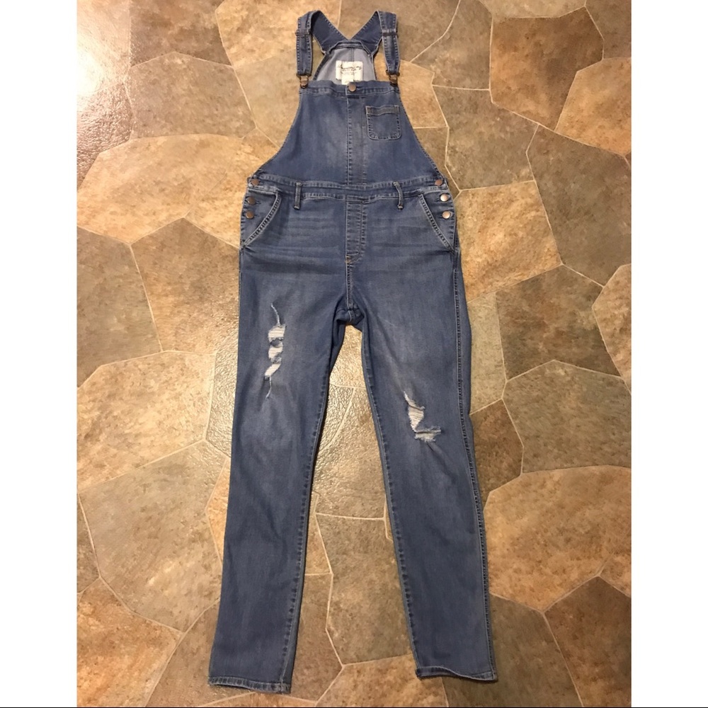 Distressed denim overalls